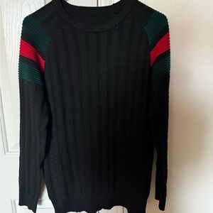 Elegant Black Crewneck Sweater with Red and Green Stripes